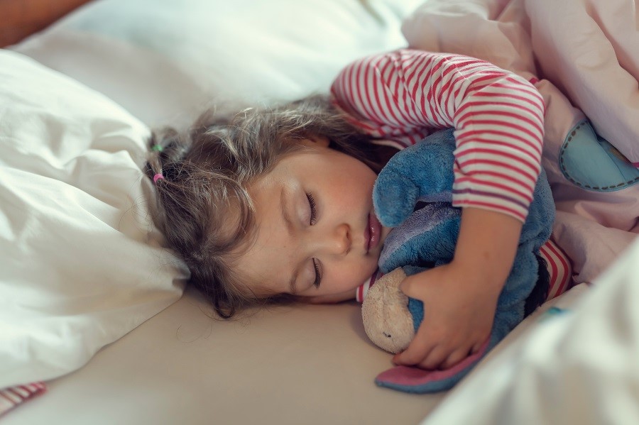 Child sleeping soundly with a home protected by Safe Home Security